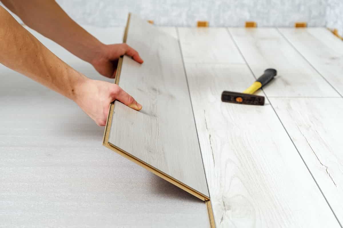 How to cut laminate flooring with padding attached